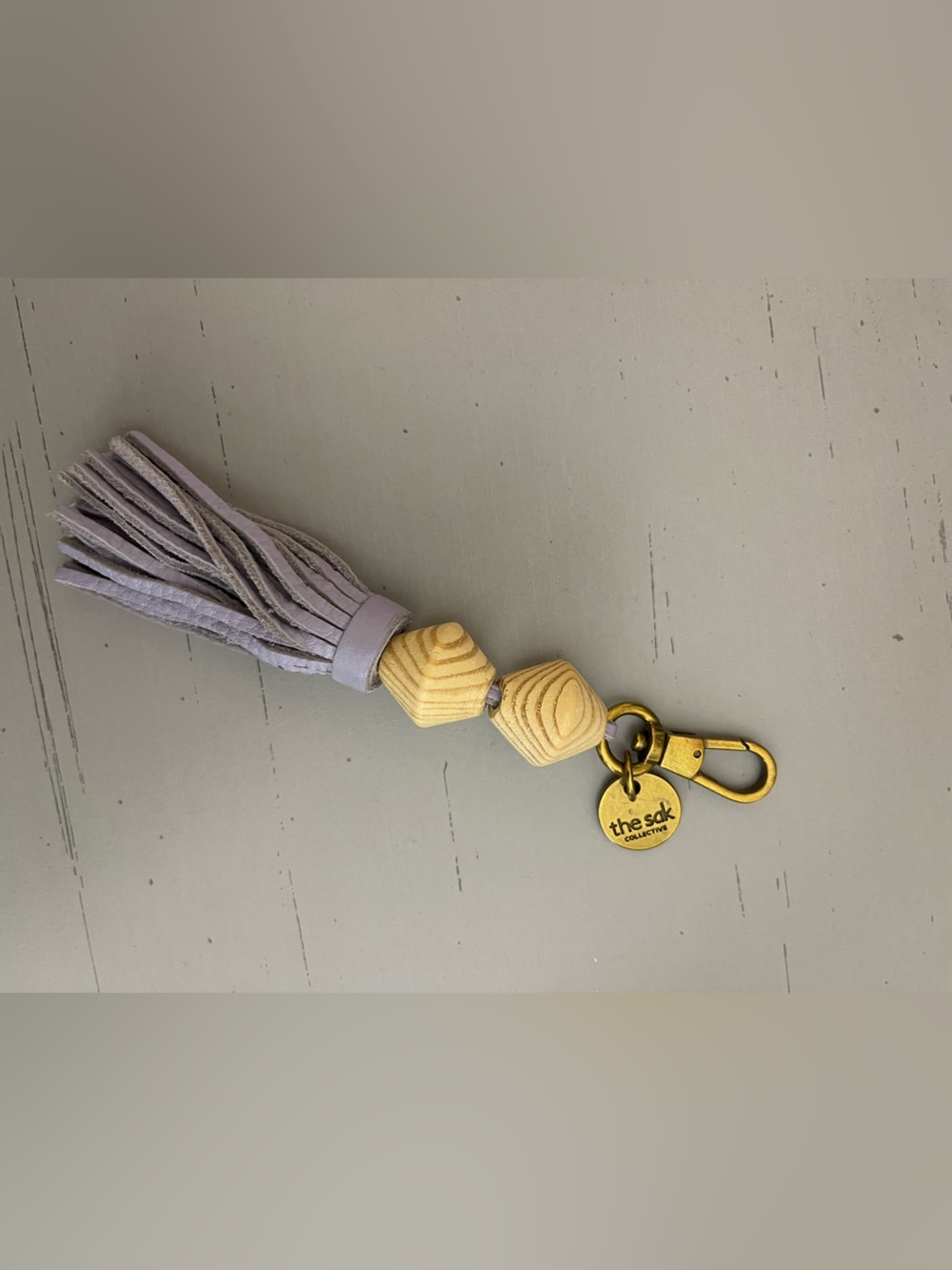 The Sak Lavender Suede Tassel Keyring with Wooden Beads